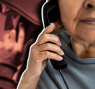 Elderly woman on the phone with a scammer.