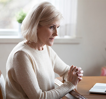 Old woman retiree worrying about money