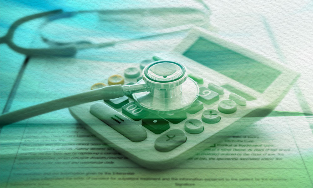 Stethoscope resting on a calculator symbolizes financial planning concepts