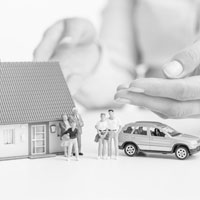 Model family, house and car signifying assets