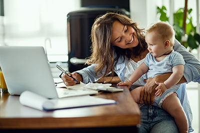 Mother making financial plans with her baby