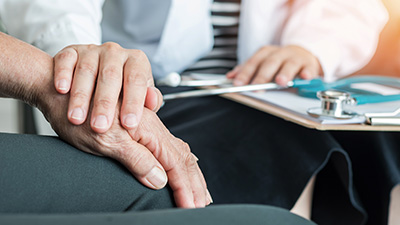 Doctor offering older man medical advice