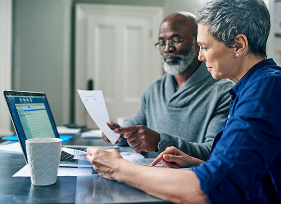 elderly couple going over finances