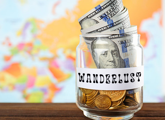 money in a jar labeled wanderlust