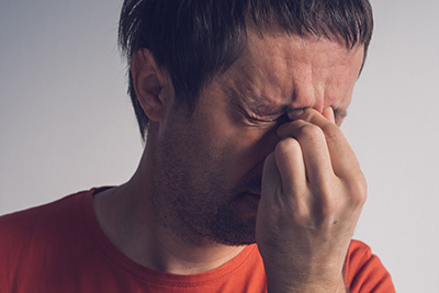 Man suffering from migraine