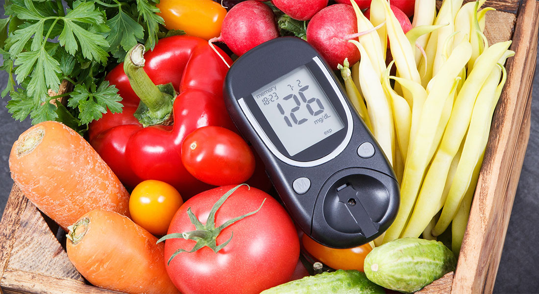 a food thermometer resting ontop of a variety of fruits and vegetables