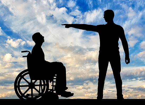 The silhouette of a standing figure casting a shadow over the seated person in a wheelchair against the vast sky echoes the towering challenges faced by those with disabilities, often obscured by societal structures that cast long shadows over equal opportunity.