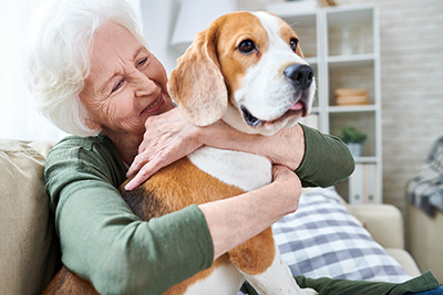 Senior woman with her dog, a beagle