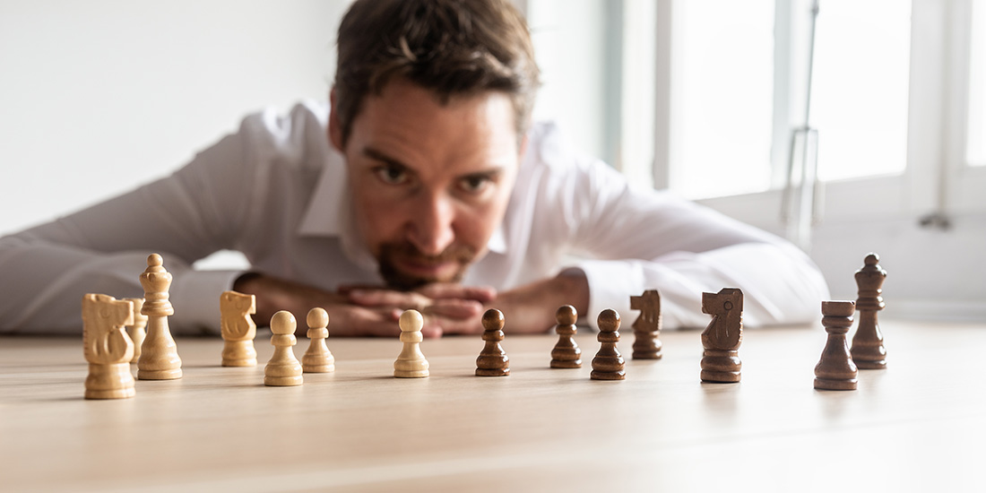 Man thinking about chess strategy