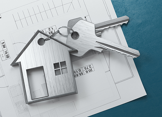 House keys sitting on top of a blueprint