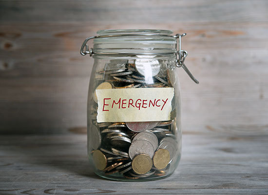 jar of money labeled emergency