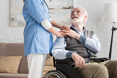 Old man appreciating his in home carer