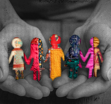 A pair of hands holds a diverse, colorful paper cutout family, symbolizing planning for Social Security and retirement benefits to support non-traditional families and chosen family retirement.