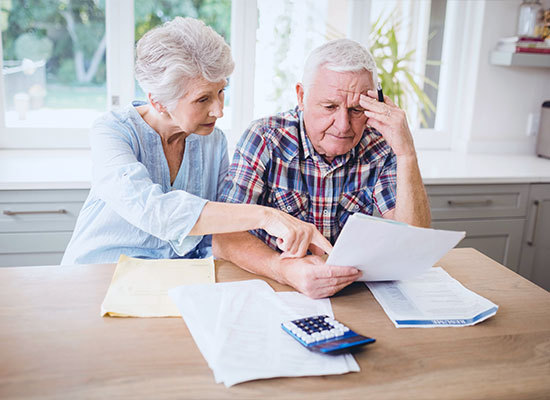 an older couple going over finances together