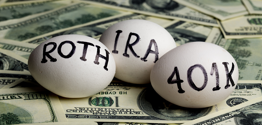 Three eggs sitting on top of hundred dollar bills with the words Roth, IRA and 401k written on them